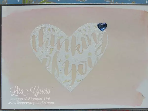 Close up of a watercolor washed resist heart. This video tutorial to teach you how to create watercolor wash backgrounds using Brusho. Stampin' Up!